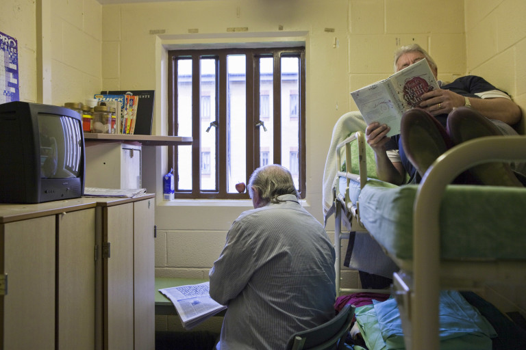 Two men read while sharing a cell in Littlehey prison