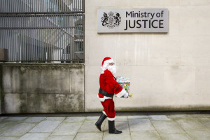 Santa along with the Howard League, English PEN delivering books for prisoners to the Ministry of Justice HQ, central London.