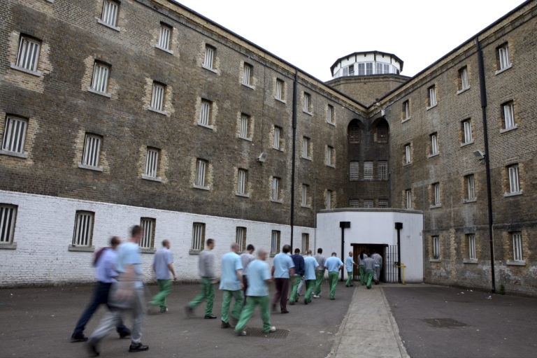 Prisoners return from their jobs to their wings at Wandsworth priso